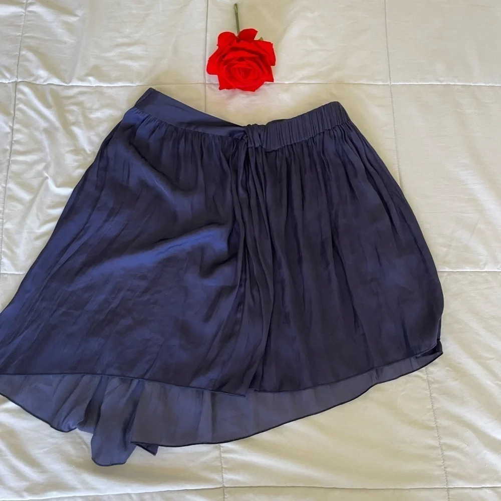 Raquel Allegra purple pleated mini skirt